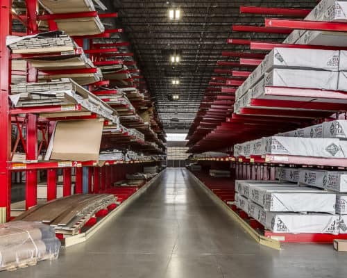 Red shelving and materials inside Riverhead Supply Building