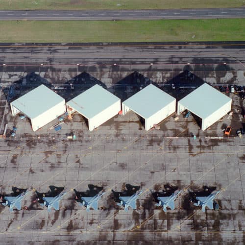 Aerial shot of hangars and fighter jets at the Air National Guard.